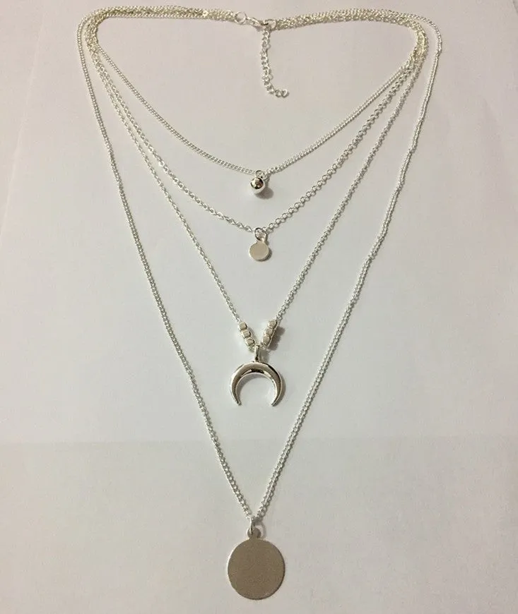 Geometric multi-layer moon disc pendant in gold alloy finish on a white background