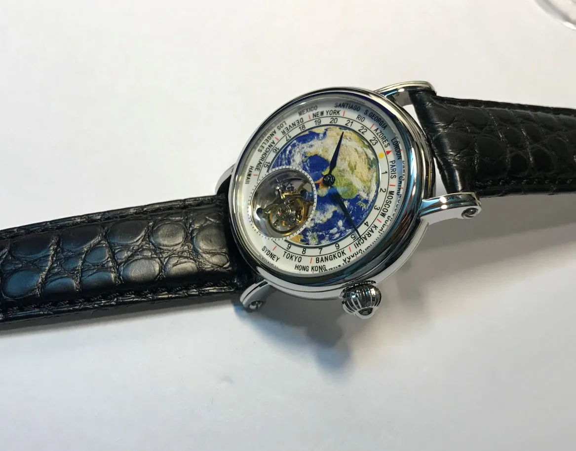 Silver 3D globe tourbillon mechanical watch with leather band and stainless steel case on white background