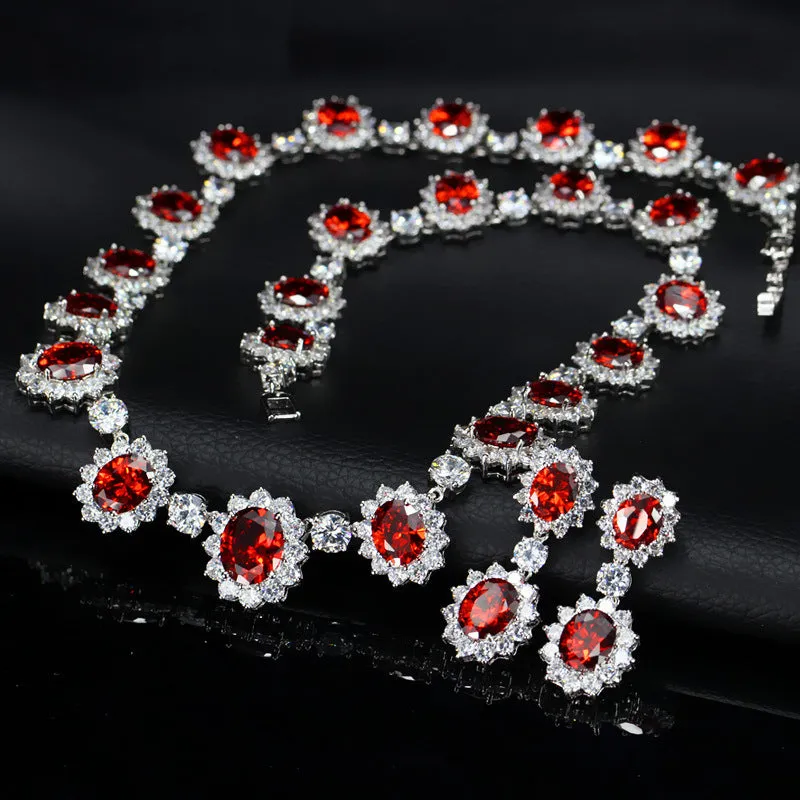Two AAA jewellery sets with necklace and earrings in blue green red and white