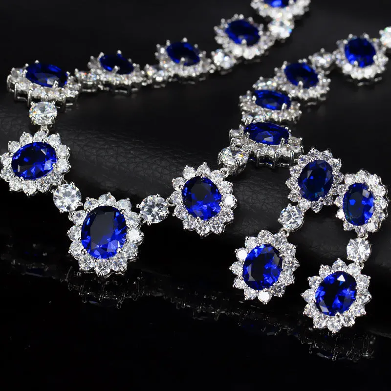 Two AAA jewellery sets with necklace and earrings in blue green red and white
