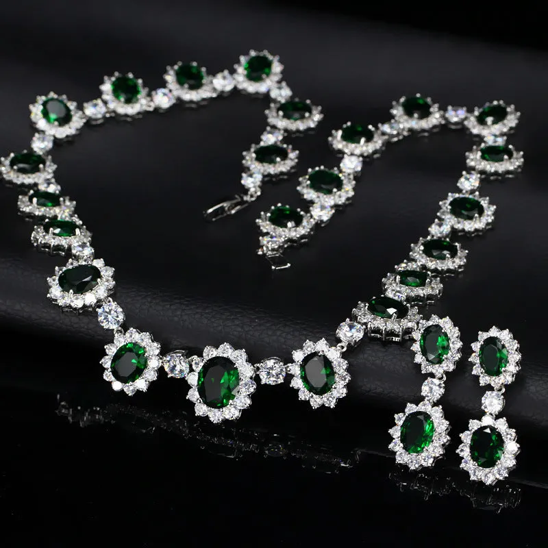 Two AAA jewellery sets with necklace and earrings in blue green red and white