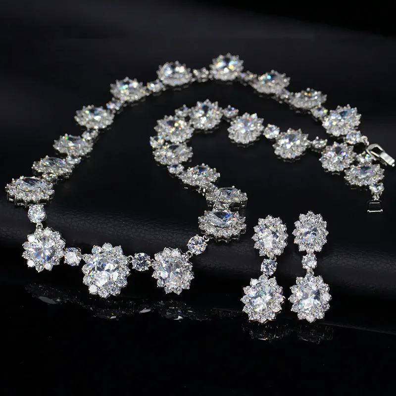 Two AAA jewellery sets with necklace and earrings in blue green red and white