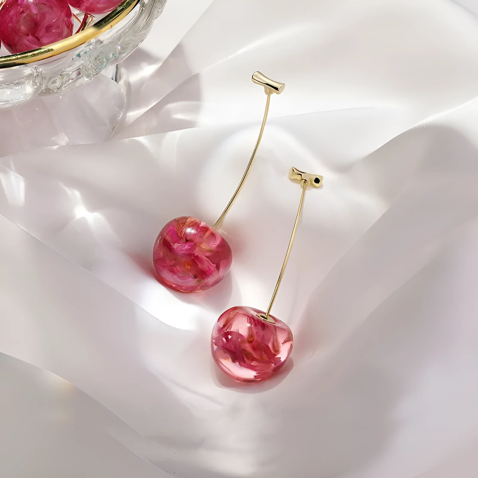 Long red French dried cherry earrings for women in plated alloy design on white background