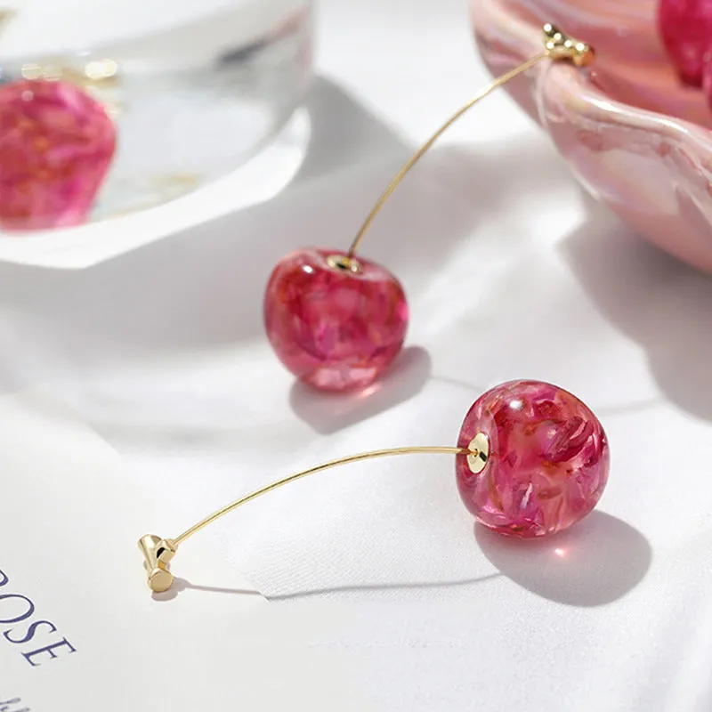 Long red French dried cherry earrings for women in plated alloy design on white background