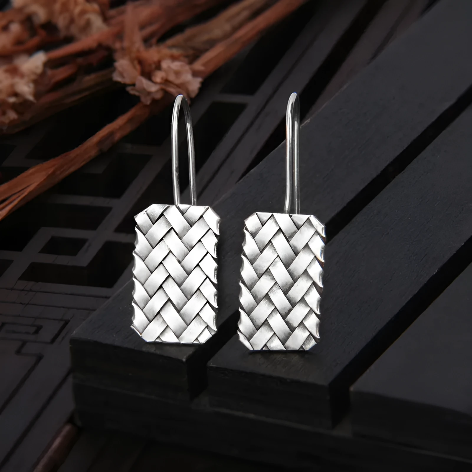 Geometric diamond plaid woven earrings in sterling silver measuring 17.5mm by 11mm