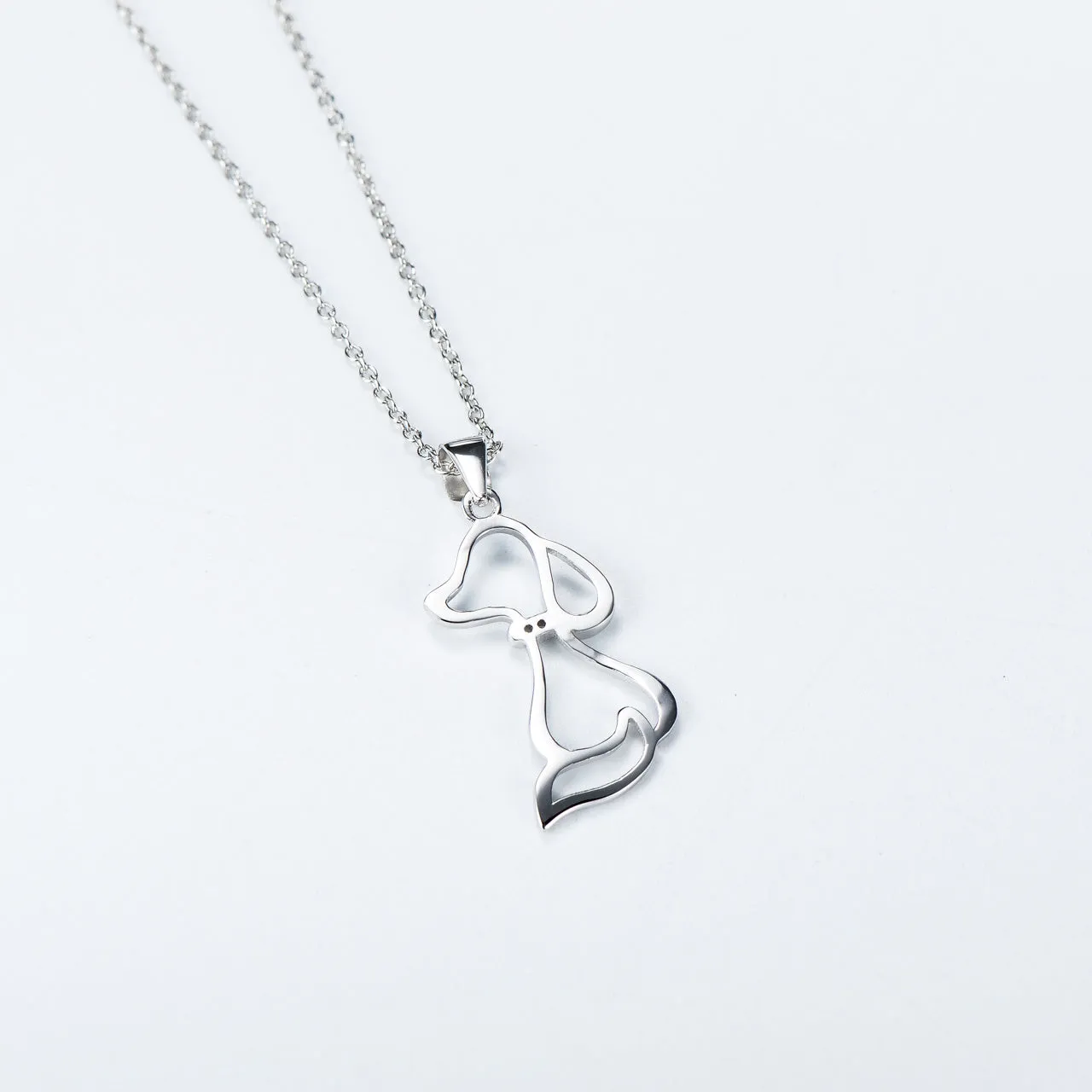 925 sterling silver dog pendant necklace with round bead chain on display