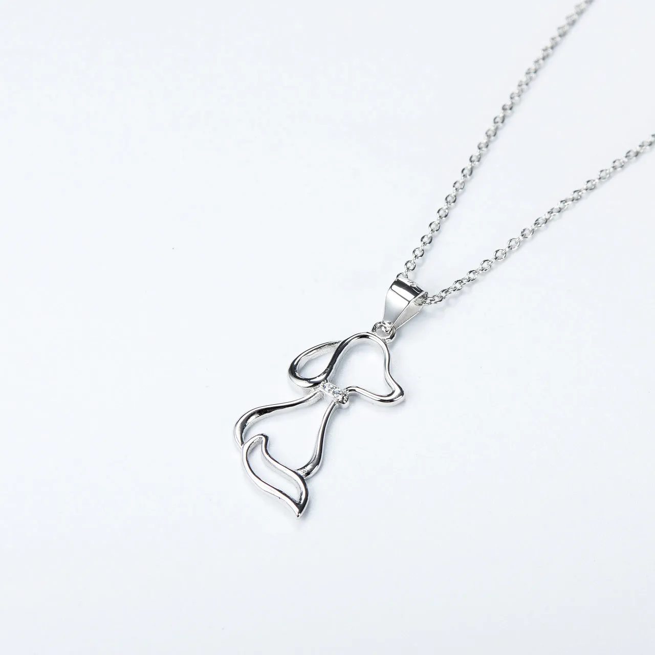 925 sterling silver dog pendant necklace with round bead chain on display