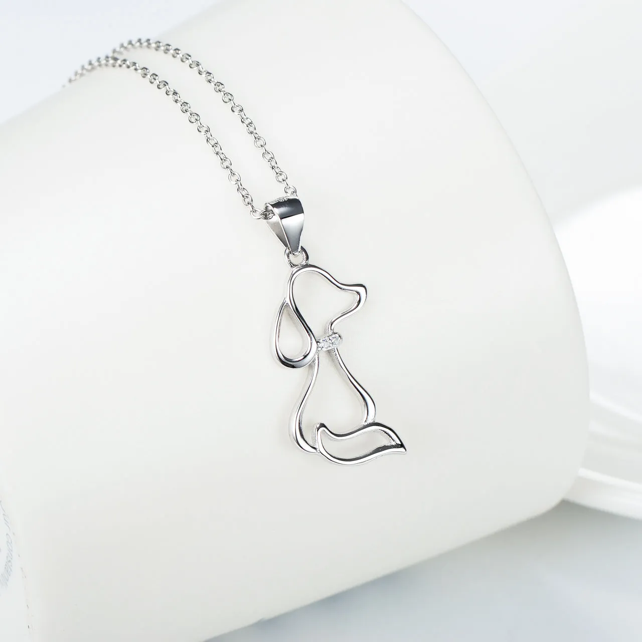 925 sterling silver dog pendant necklace with round bead chain on display