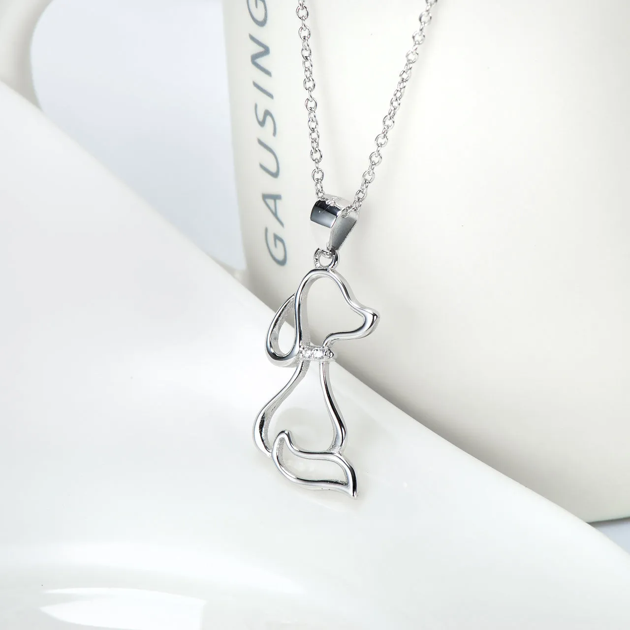 925 sterling silver dog pendant necklace with round bead chain on display