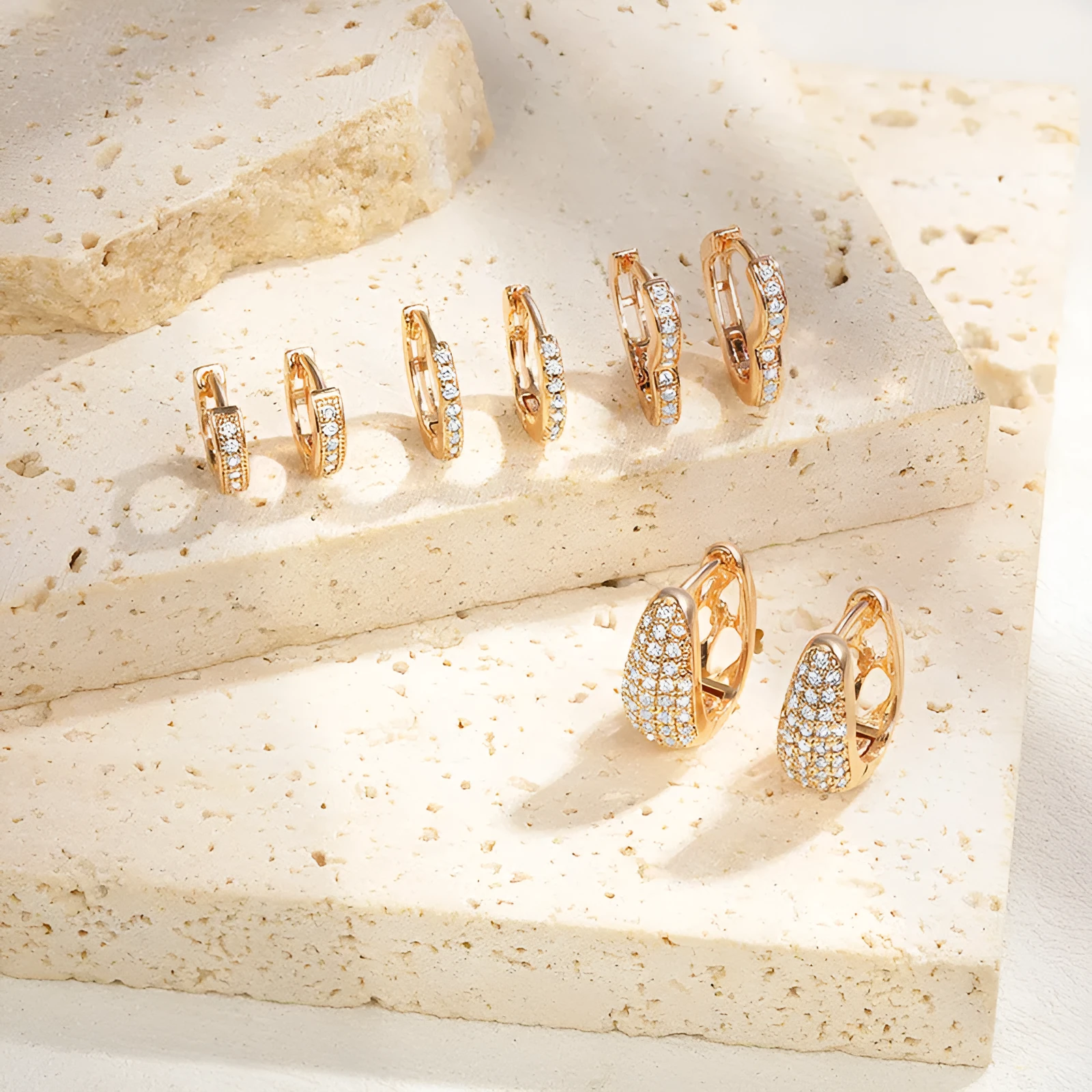 Gold plated heart shape clip earrings with cubic zirconia stones, shown in champagne gold tone colour