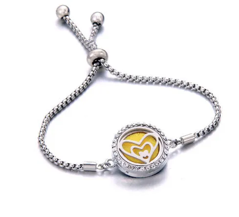 Hollow stainless steel adjustable aromatherapy bracelet with 20mm box diameter and electroplated alloy finish on white background