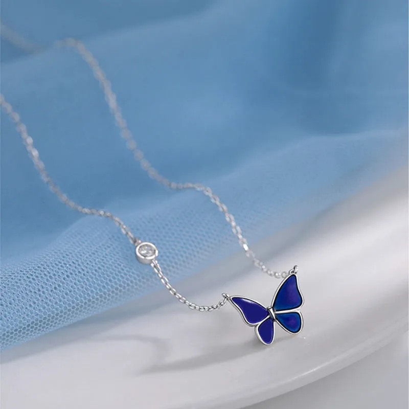 S925 silver butterfly necklace with white silver colour-change pendant on display
