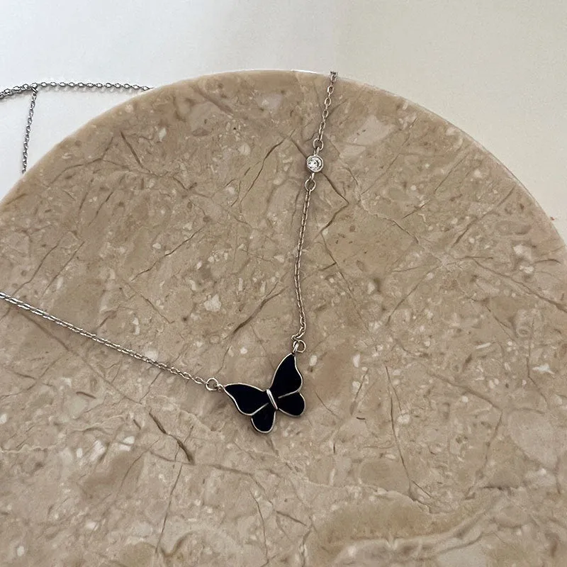 S925 silver butterfly necklace with white silver colour-change pendant on display