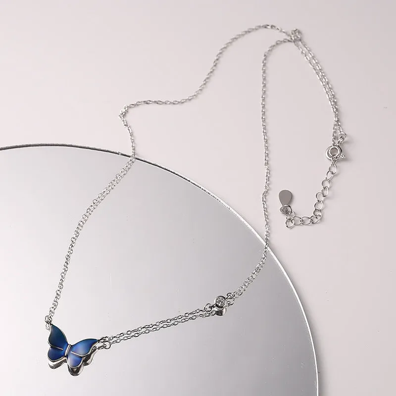 S925 silver butterfly necklace with white silver colour-change pendant on display