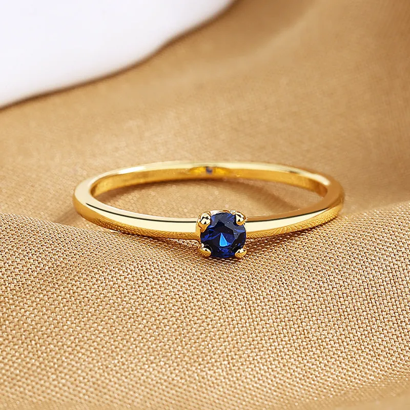Geometric copper women's ring with single diamond in circle design, shown in available colours.