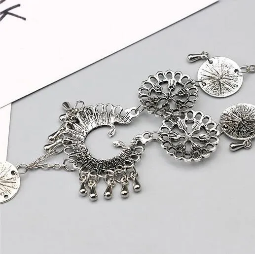 Antique silver hollow flower chain anklet with teardrop shape on a surface, 24cm foot jewellery for women