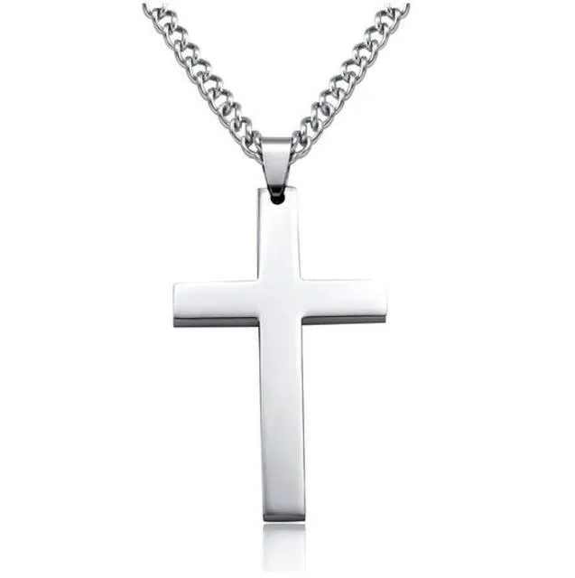 Stainless steel titanium alloy cross pendant on a black whip chain against a dark background