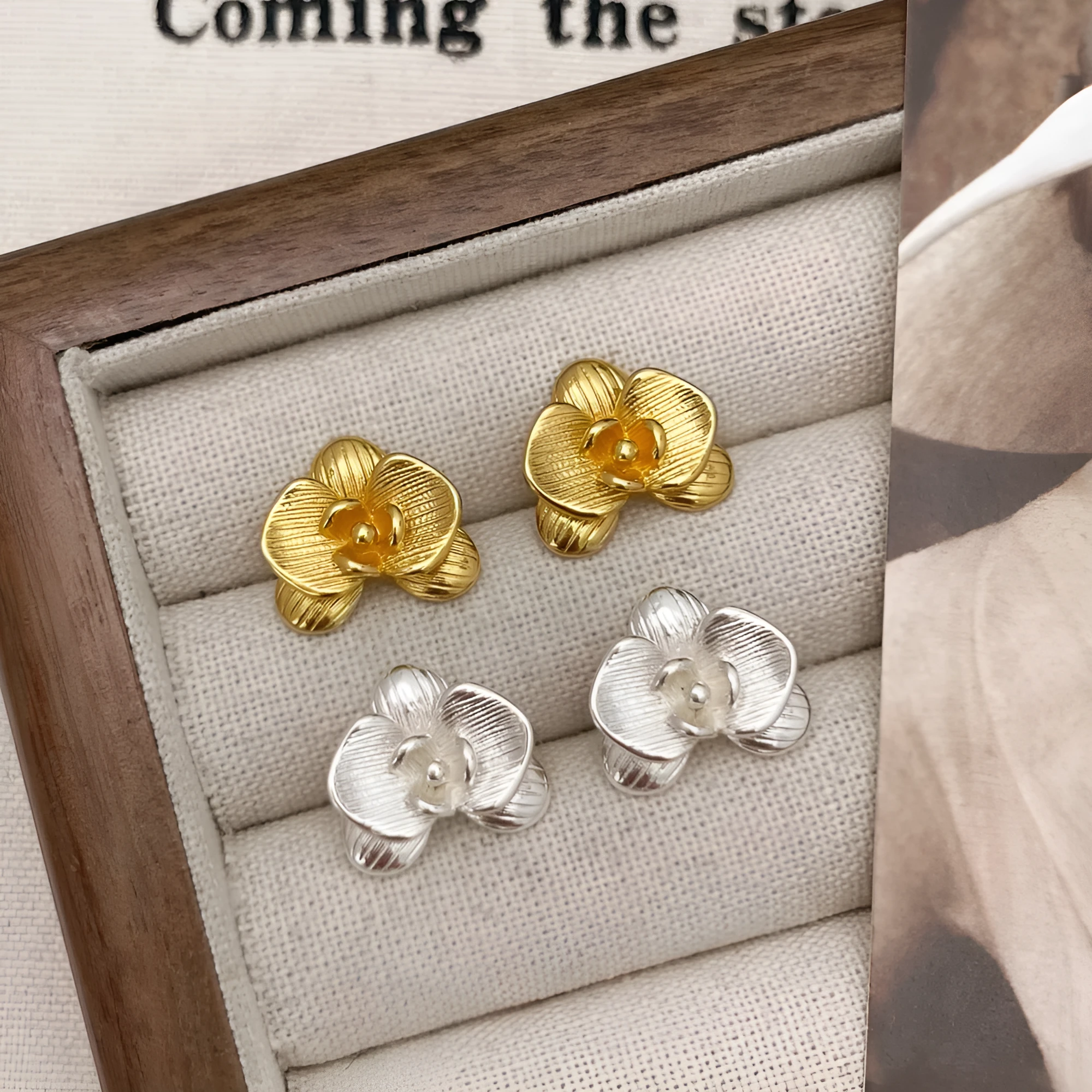 Retro floral earrings for women in gold and silver colours with petal design