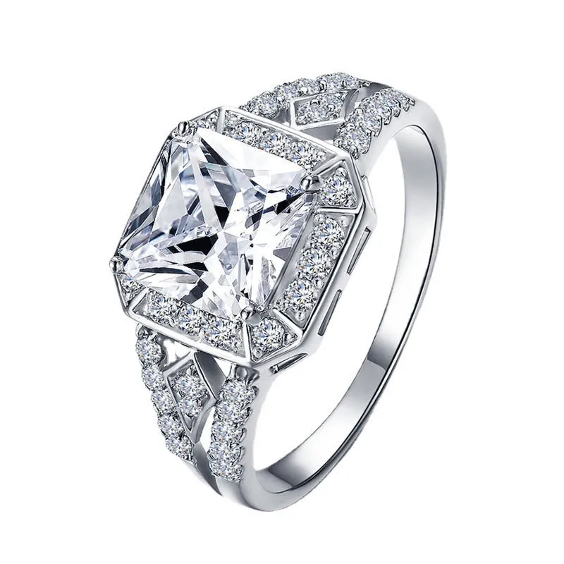 Geometric hollow design women's zircon ring in platinum finish on copper, showing quadrilateral stone.