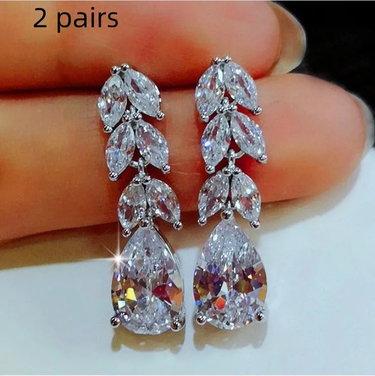 Silver alloy hoop earrings for women, no inlaid stones, lightweight design, two pairs shown on white background