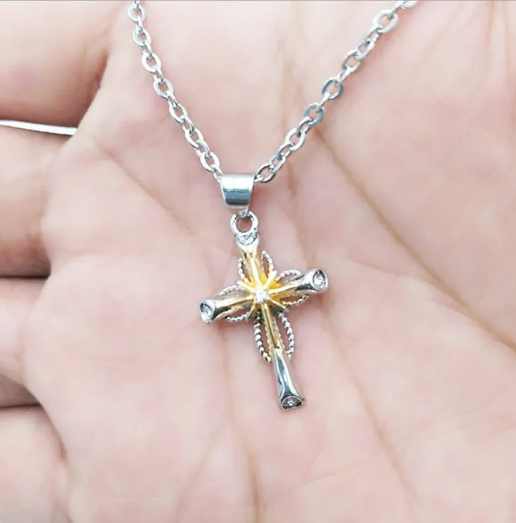 Silver alloy cross pendant with octagonal star detail on ring chain, 22x15mm size