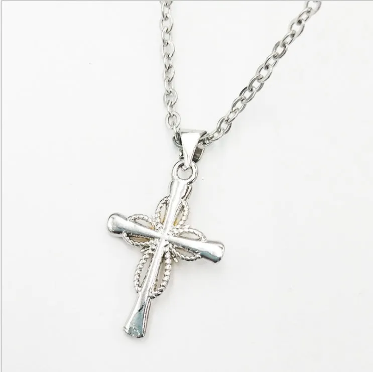 Silver alloy cross pendant with octagonal star detail on ring chain, 22x15mm size