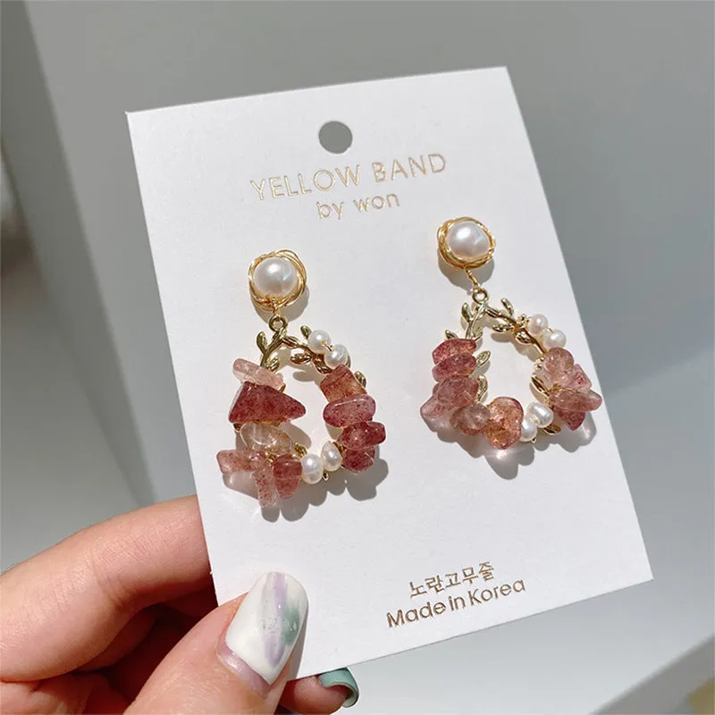 Pink crystal leaf design earrings with silver plated finish on alloy base