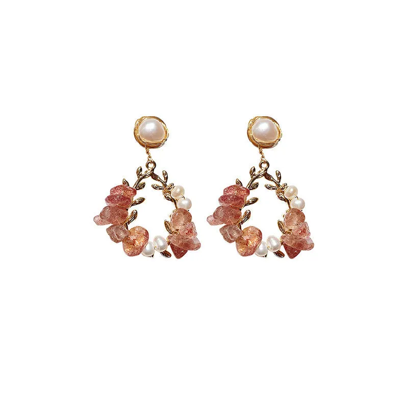 Pink crystal leaf design earrings with silver plated finish on alloy base