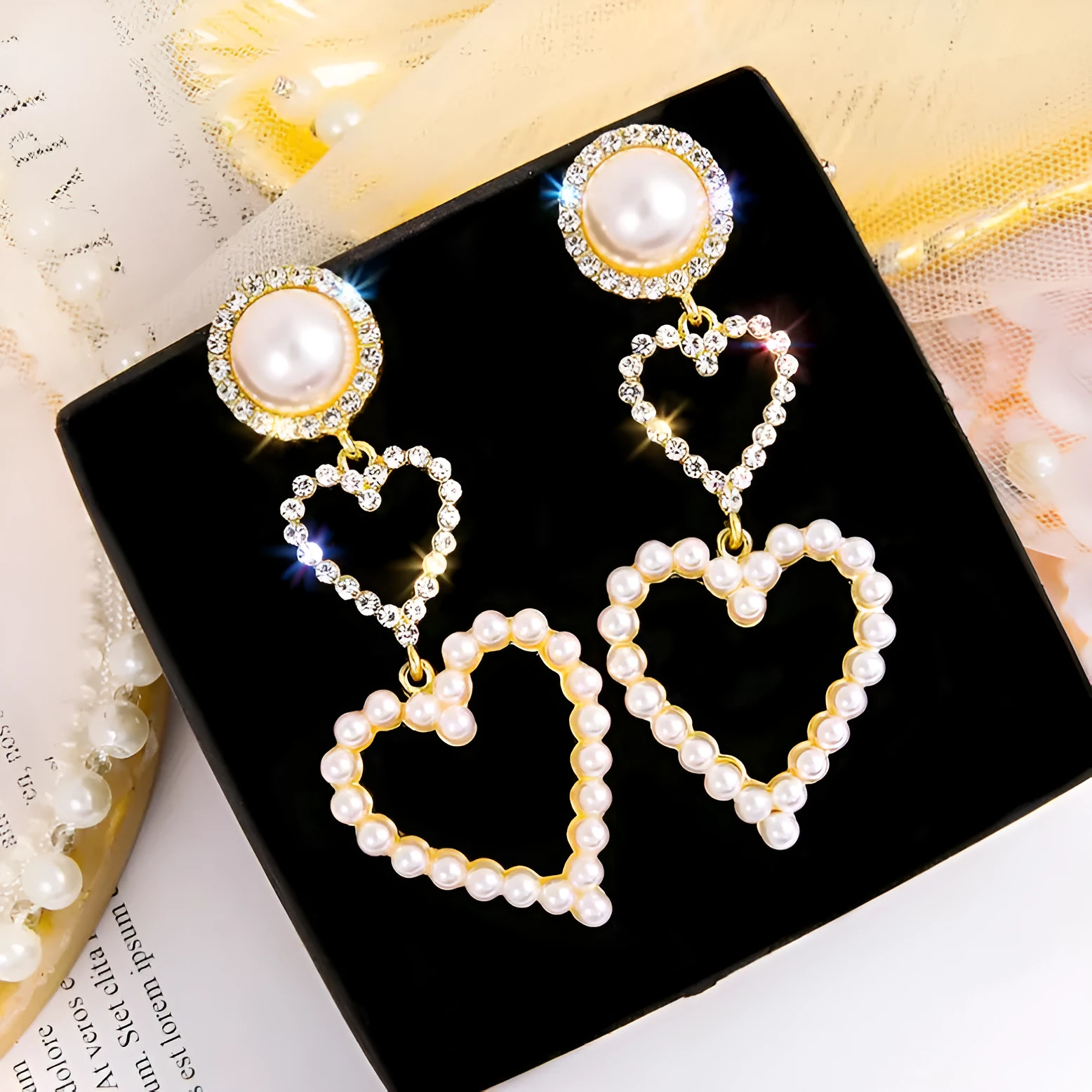 Pair of gold pearl rhinestone drop earrings on a plain background, measuring 7x2.5cm