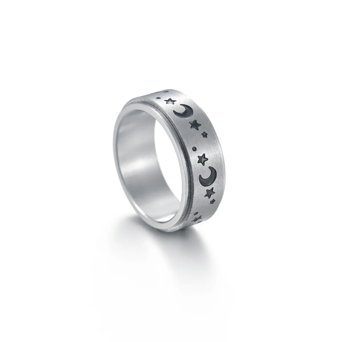 Titanium steel star moon ring in glossy finish on a neutral background, showing celestial motif and band width
