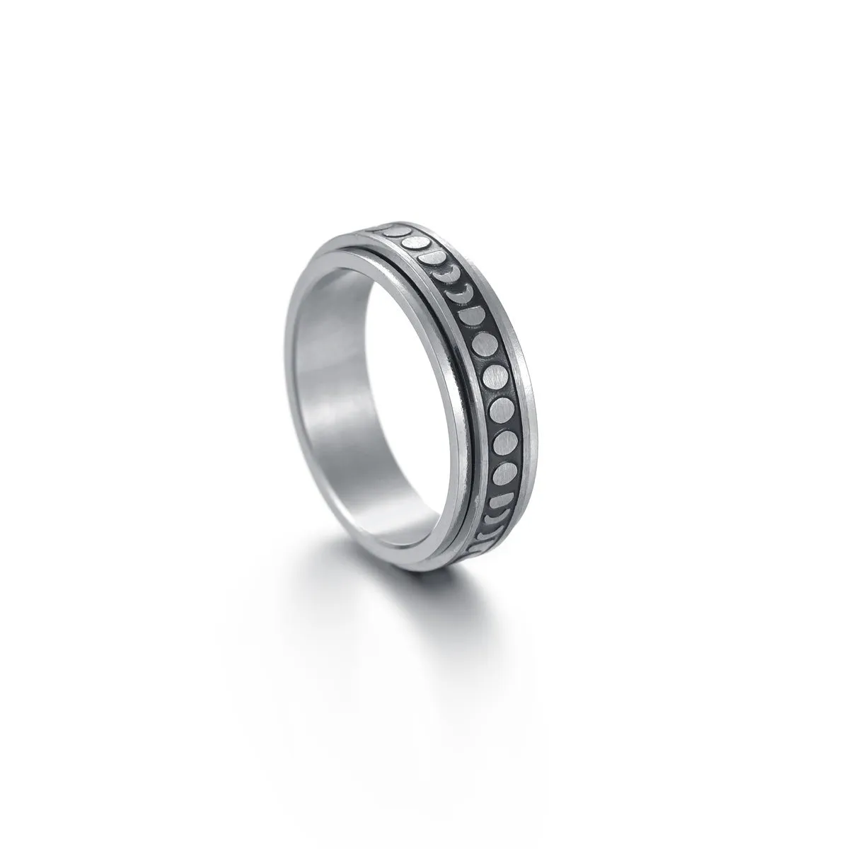 Titanium steel star moon ring in glossy finish on a neutral background, showing celestial motif and band width