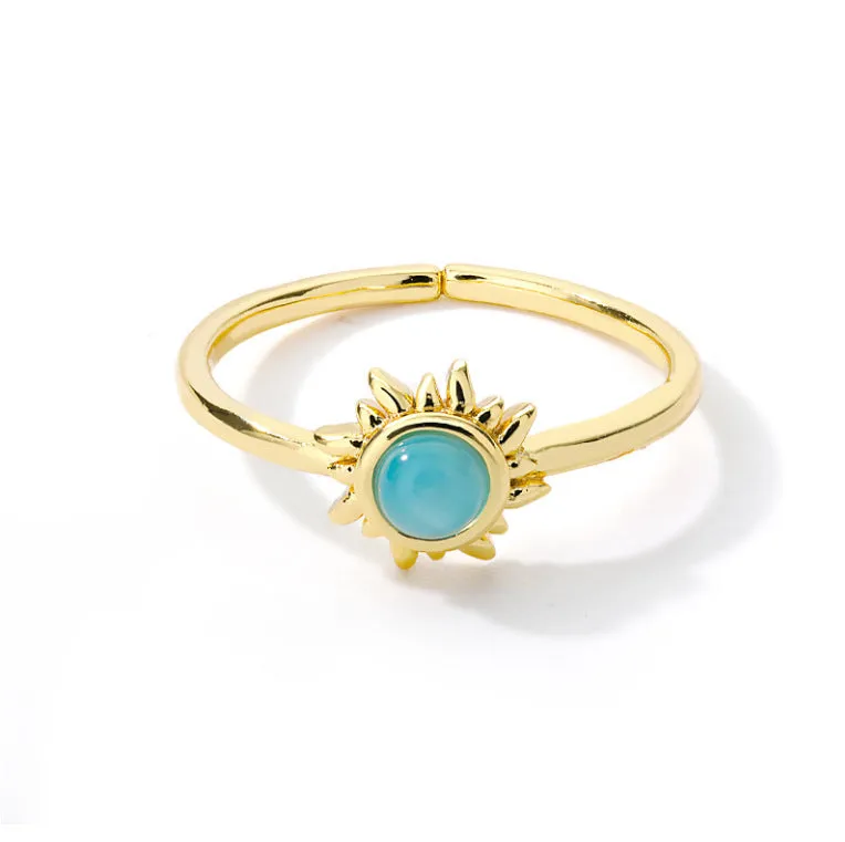 Stainless steel ring with gold electroplated lotus and moon-sun plant design, 9mm face width