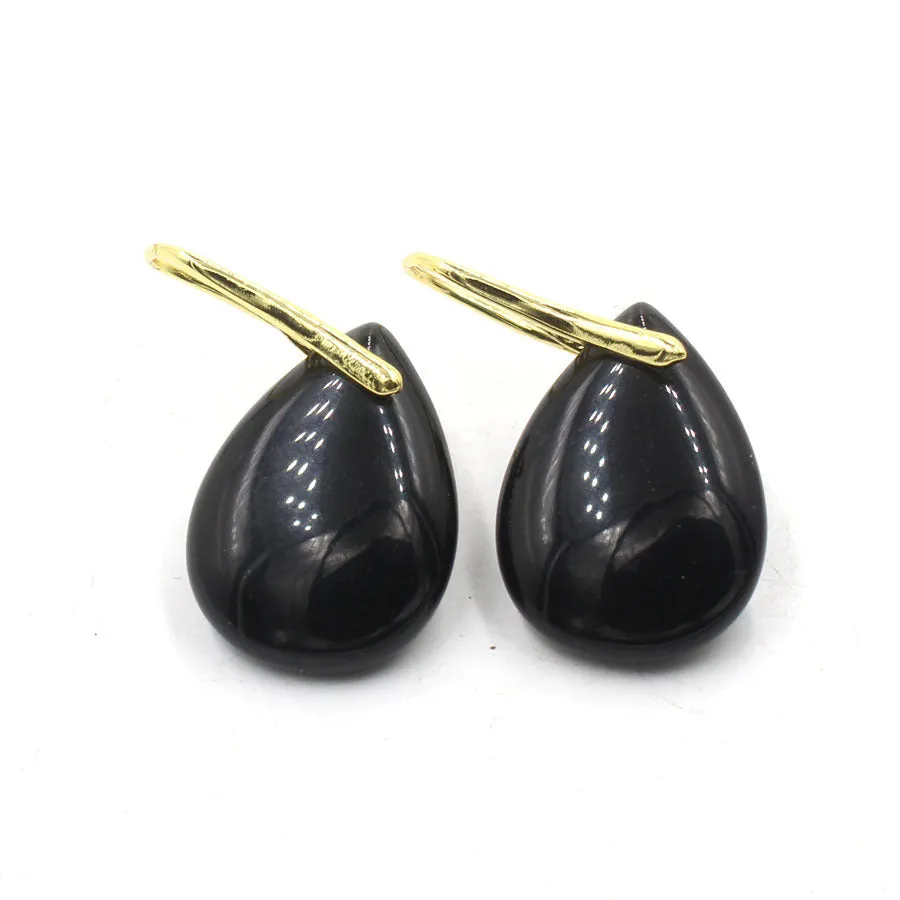A pair of geometric water drop shaped earrings made from crystal in an electroplated finish.