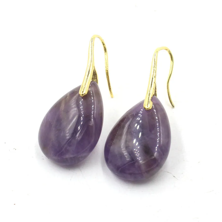 A pair of geometric water drop shaped earrings made from crystal in an electroplated finish.