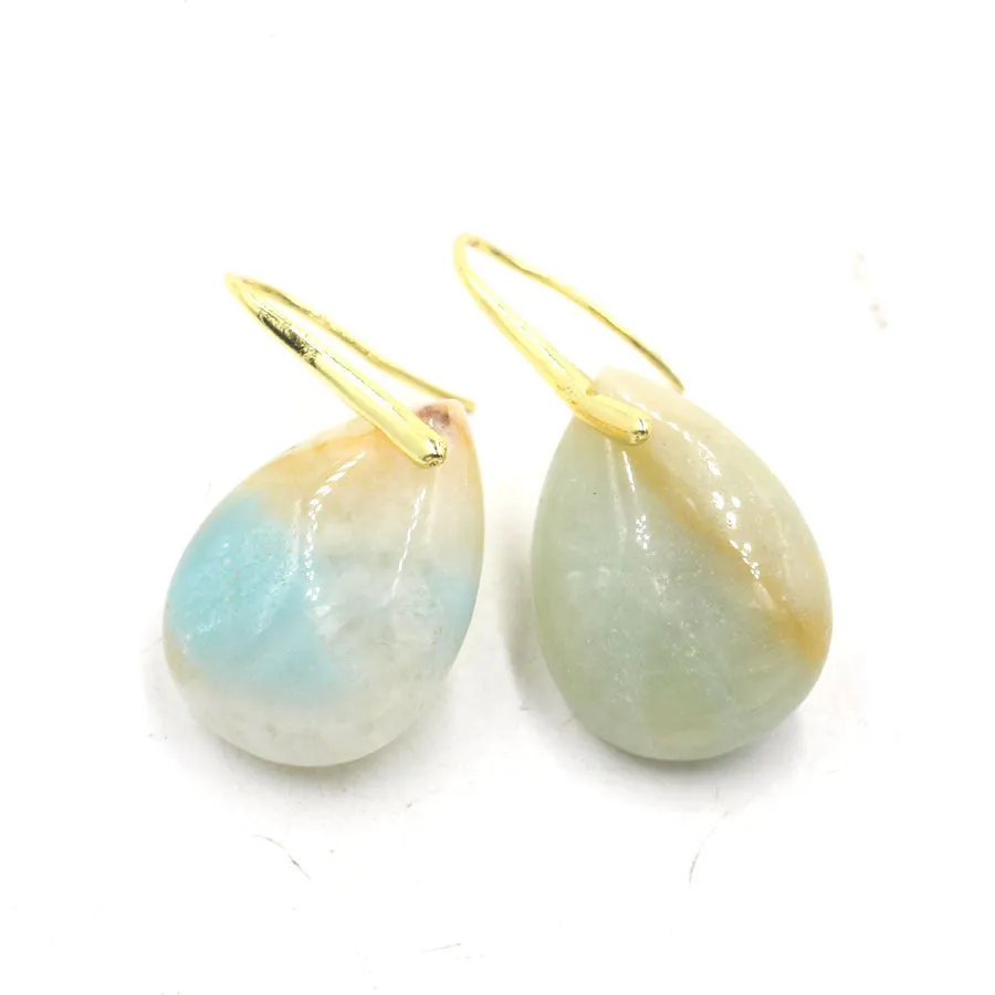 A pair of geometric water drop shaped earrings made from crystal in an electroplated finish.