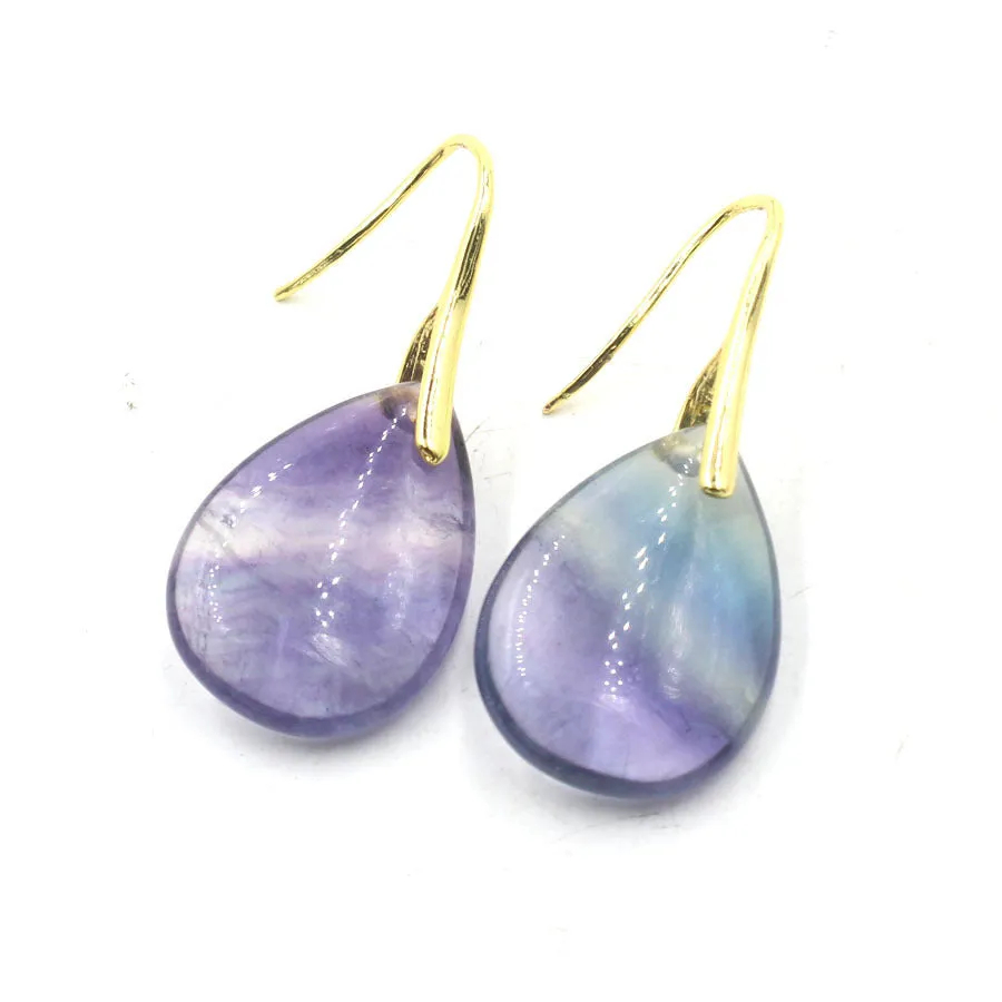 A pair of geometric water drop shaped earrings made from crystal in an electroplated finish.