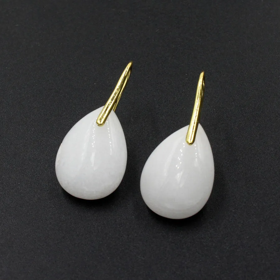 A pair of geometric water drop shaped earrings made from crystal in an electroplated finish.