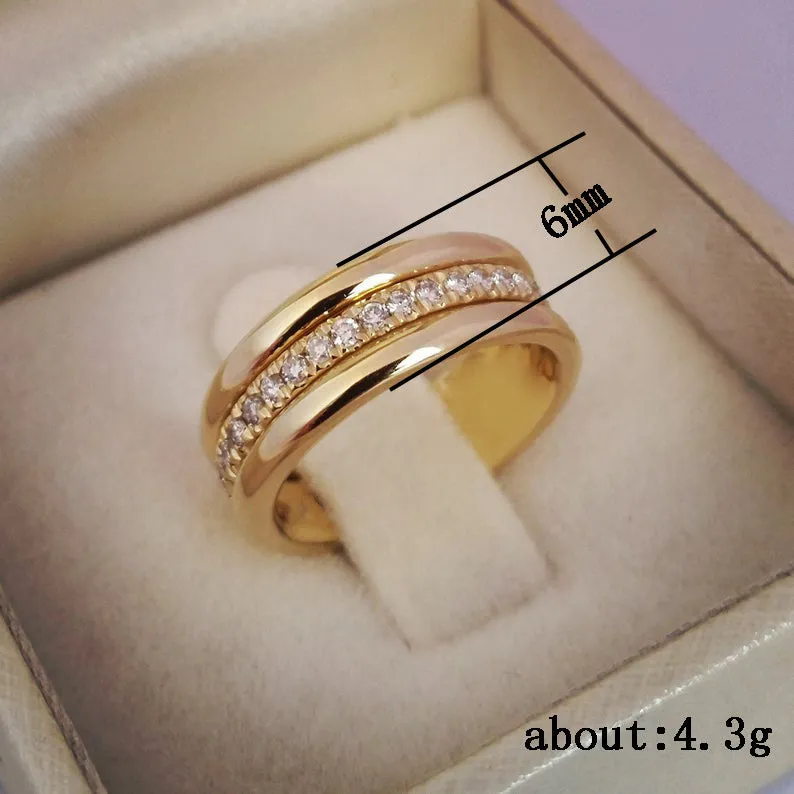 Gold plated geometric rhinestone ring with inlaid stone on white background, size options