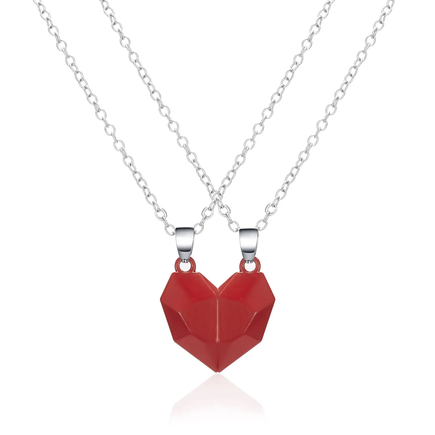 Gold-plated magnetic faceted heart pendant necklace in black and white on display