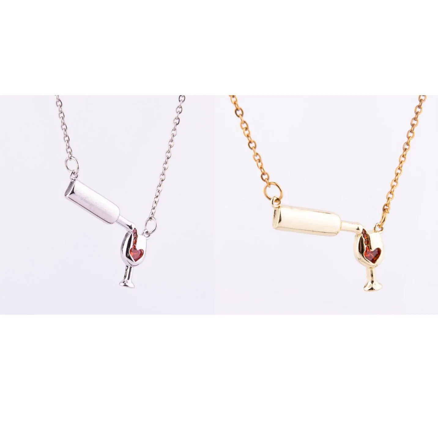 Gold alloy wine bottle and glass pendant necklace on a light background