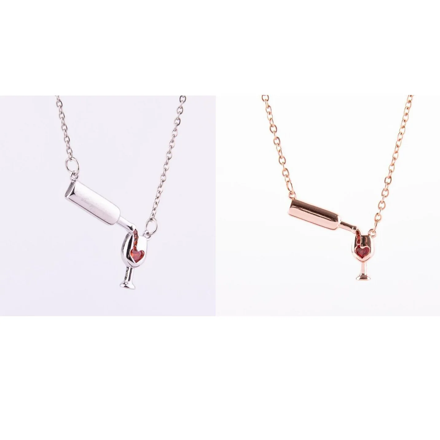 Gold alloy wine bottle and glass pendant necklace on a light background
