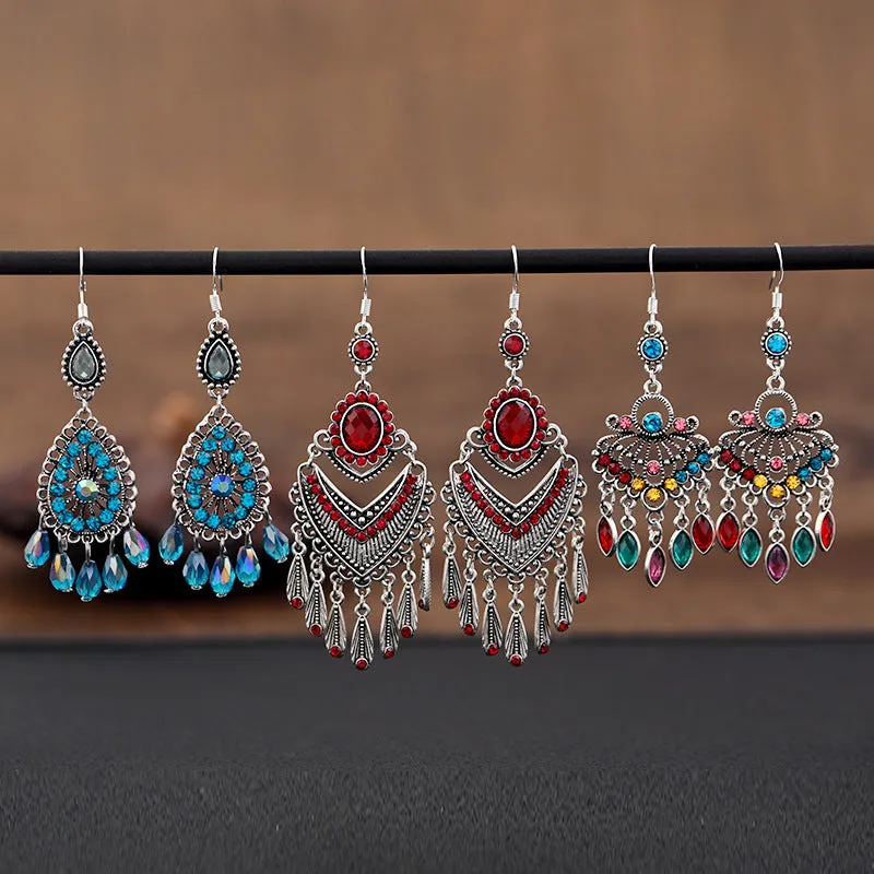 Retro long drop earrings with purple crystal fringes on an alloy setting.
