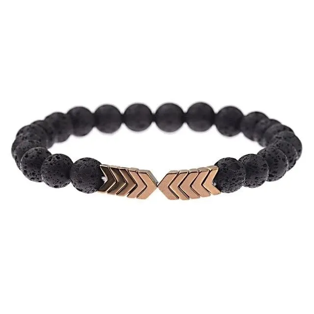 Purple Arrow volcanic stone bracelet on a neutral background showing bead texture and elastic cord