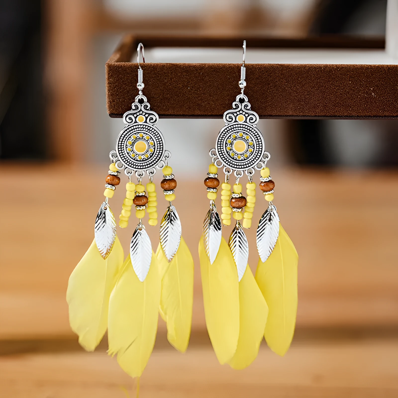 Handmade feather pattern bohemian earrings in multiple colours with leaf design detail