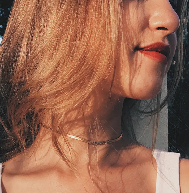 Star Goddess gold duo layering choker necklace on display