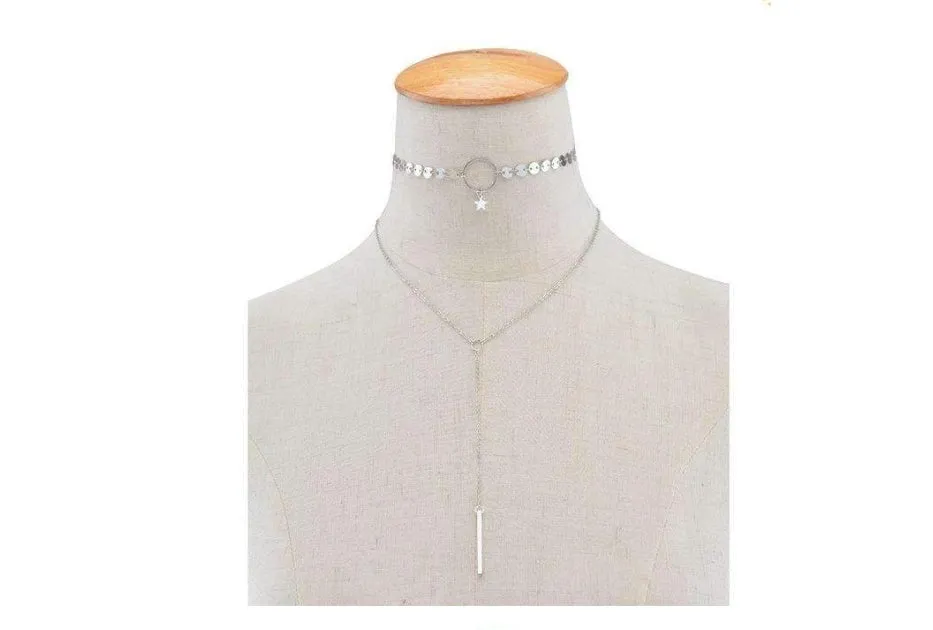Star Goddess gold duo layering choker necklace on display