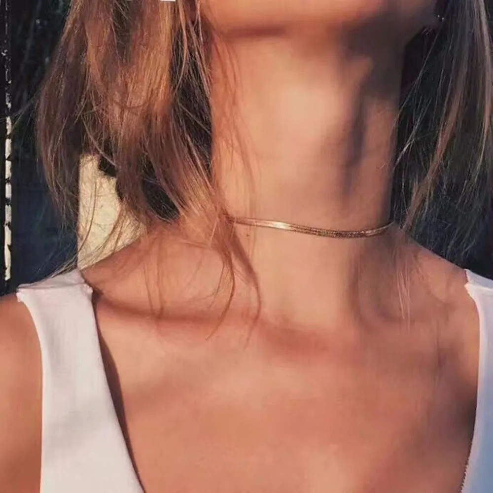 Star Goddess gold duo layering choker necklace on display
