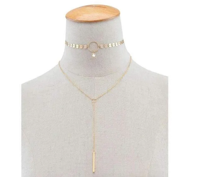 Star Goddess gold duo layering choker necklace on display