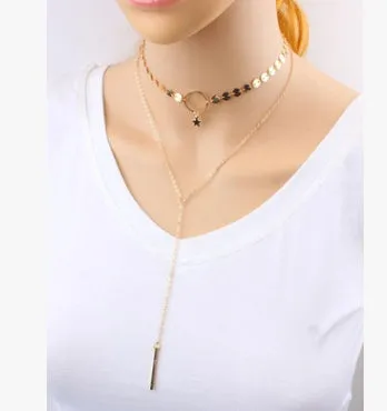 Star Goddess gold duo layering choker necklace on display
