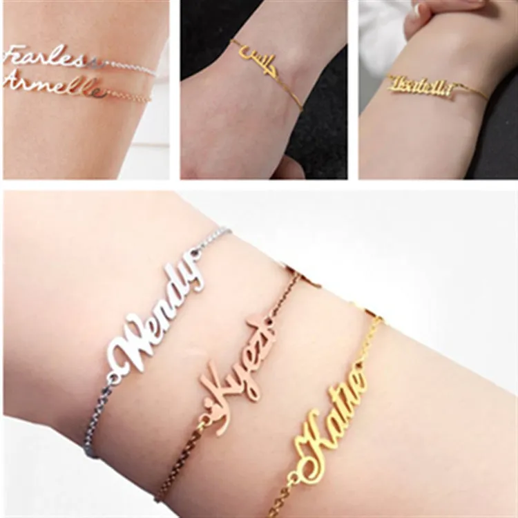 Gold titanium steel cable chain anklet with personalised name engraving on a sandy beach background